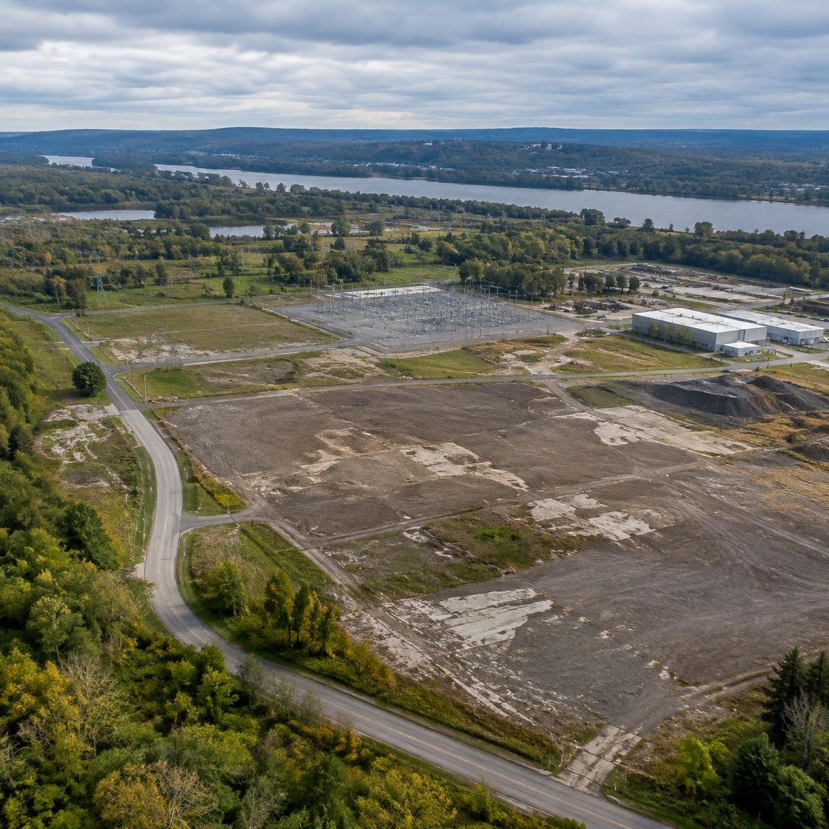 Conceptual aerial view of previously developed industrial land near electrical infrastructure